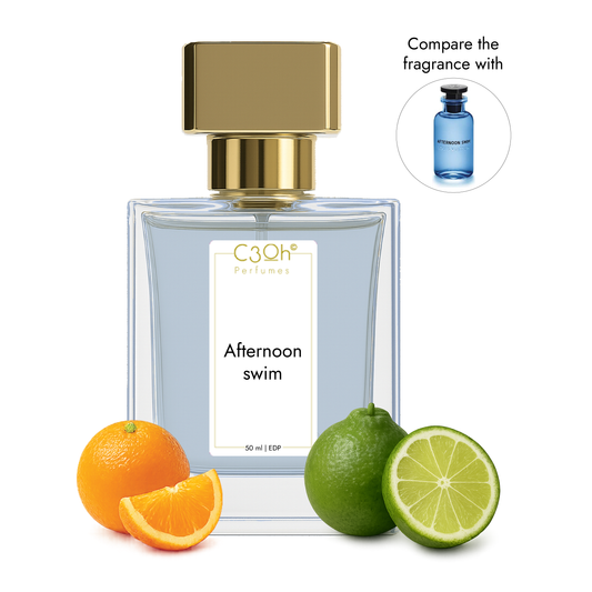 Perfume bottle labeled 'Louis Vuitton Afternoon swim' with oranges and limes on a white background